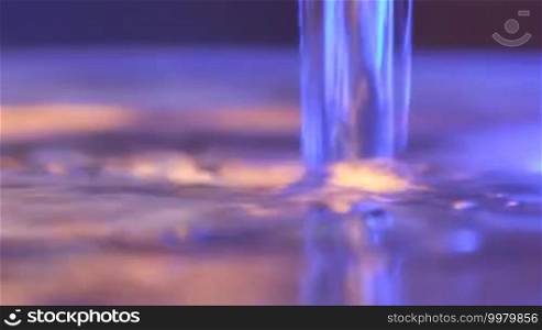 Jet of water forms bubbles on the surface
