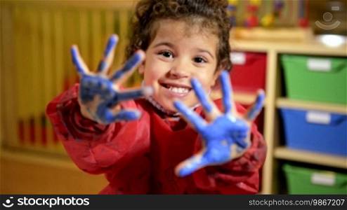 Kids, school and education, happy children having fun and painting with hands in kindergarten. Sequence