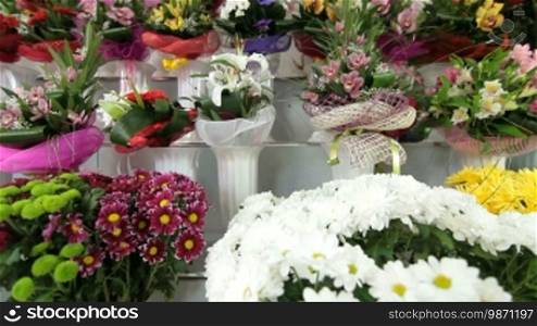 Large Variety Of Fresh Flower Arrangements In Florist Shop, Tracking Shot