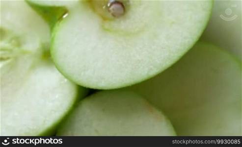 Macro shot of a green apple fruit spinning