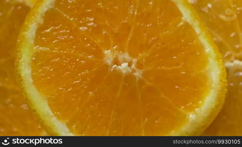 Macro shot of an orange fruit spinning