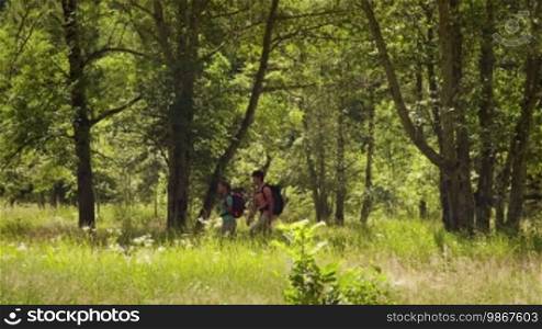 Man and woman walking during excursion in the woods, young people hiking and trekking on mountains. Part 5 of 12