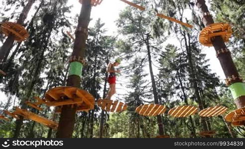 Man climbing the trees in Adventure Park