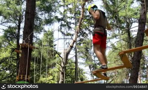 Man climbing the trees in Adventure Park