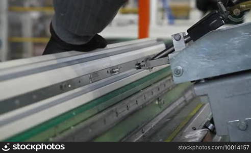 Man finishing window in factory