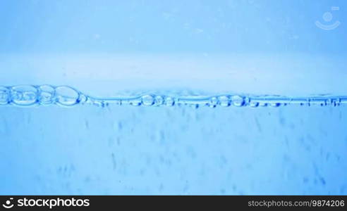 Many bubbles in water close up, abstract water wave with bubbles