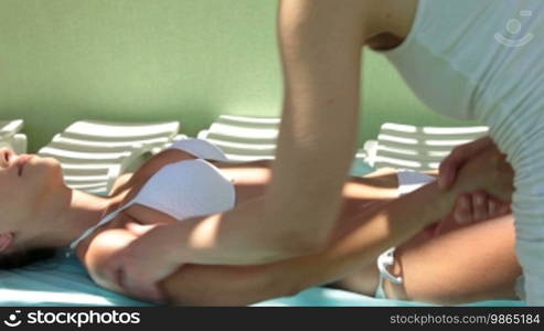 Massage Therapist Massaging a Young Woman