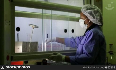 Medical research center and industrial facility, female technician at work and cleaning vaccine test tubes in scientific laboratory. Sequence
