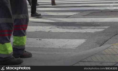 Medium shot of feet crossing the street in downtown Buenos Aires, Argentina in slow motion series 2