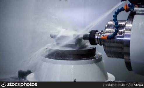 Metalworking CNC milling machine. Cutting metal modern processing technology. Small depth of field.