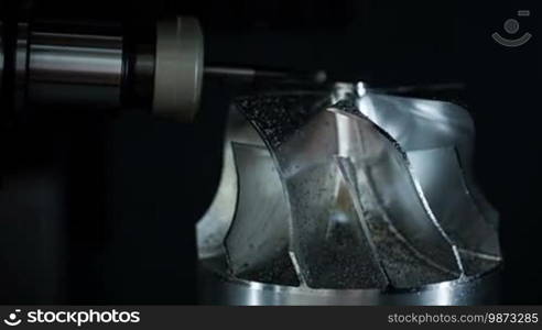 Metalworking CNC milling machine. Cutting metal modern processing technology. Small depth of field. Warning - authentic shooting in challenging conditions. A little bit grain and maybe blurred.