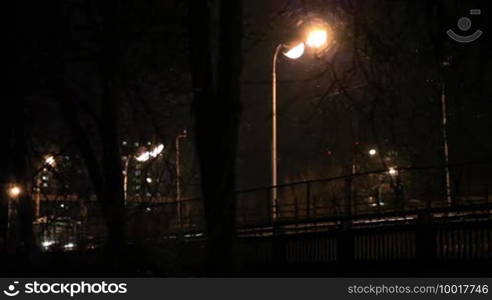 Metro subway train outdoors at night.