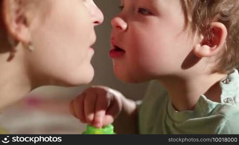 Mom and her son kissing. Lovely close ups.