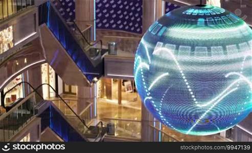 MOSCOW, RUSSIA - DECEMBER 18: Big bright digital Christmas ball with winter animation hanging in shopping centre Rio in Leninsky Avenue. Interior decoration during Christmas holidays. Shot on December 18, 2013, Moscow, Russia