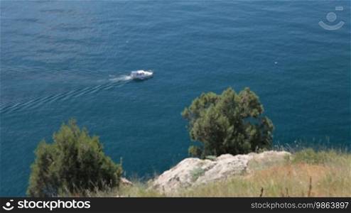 Motorboat sailing along the seashore, Black Sea, Balaklava, Crimea, Ukraine