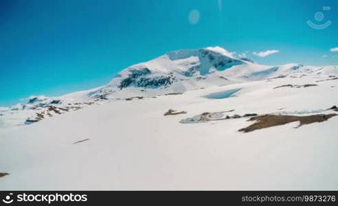 Mountain road in Norway with high snow wall