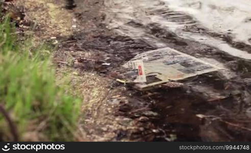 Newspaper in water