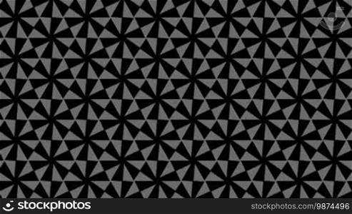 On a black background mosaic of slowly rotating the light-gray spirals, changing its pattern and returning to the initial form.