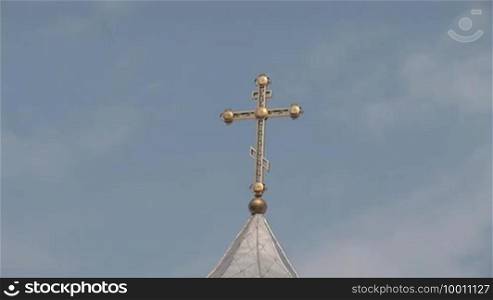 Orthodox cross on the dome of the monastery
