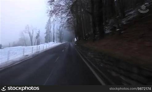 Over a winding road with poor visibility