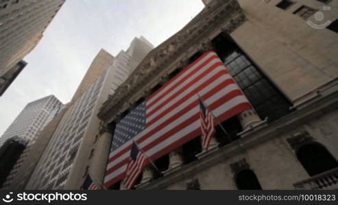 Pan over Financial District Buildings ending on Stock Exchange Building exterior, on July 17th, 2010, New York City