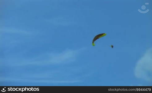 Paragliding in the blue sky