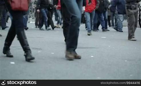 People legs walking in city