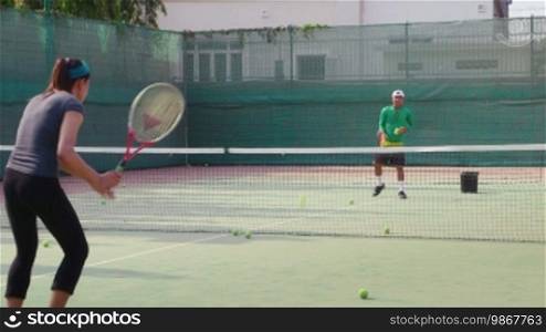 People, man and woman playing tennis, game, match, sport. Tennis school. 23 of 26