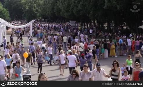 People walking at Park Kultury at the Children's day.