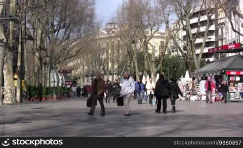 People walking in Barcelona main street. Recognizable faces, please only editorial use.