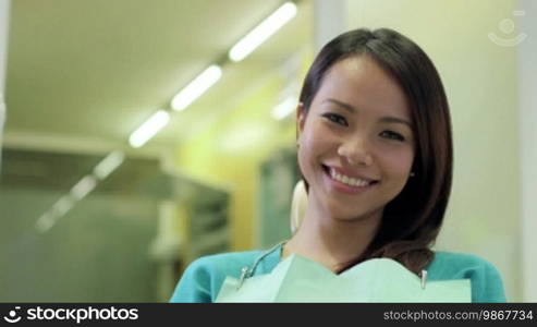 Portrait of a happy Asian woman as a patient smiling in a dentist studio, people and oral hygiene, health care in a clinic. 12 of 19