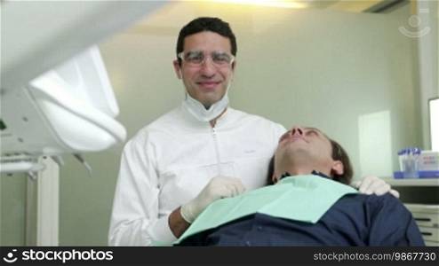 Portrait of a happy Hispanic man working as a dentist in a dental studio, people and oral hygiene, health care in a hospital. 5 of 19