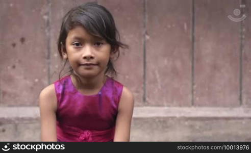 Portrait of cute Asian female child looking at camera. Copy space