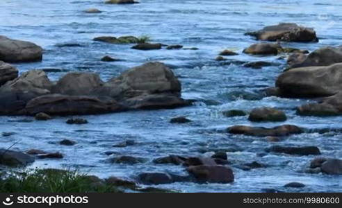 Rapid flow of the river through the stones