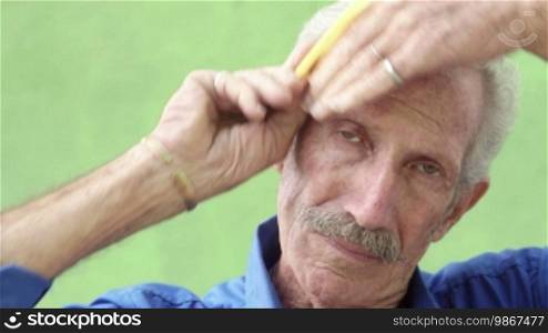 Retired old men, portrait of senior Hispanic man with mustache looking and smiling at camera, combing hair. Sequence