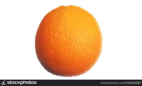 Ripe fresh orange rotating along vertical axis, close-up, white background with alpha channel