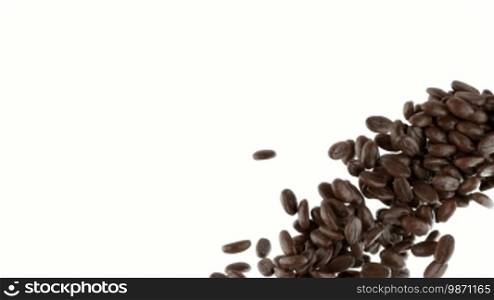 Roasted coffee beans falling and mixing with slow motion