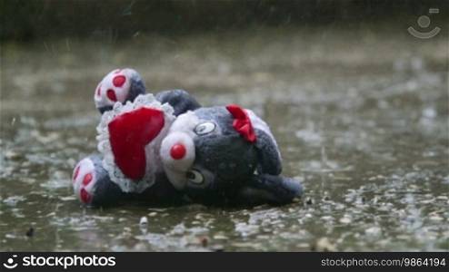 Romantic stuffed toy lost in the rain