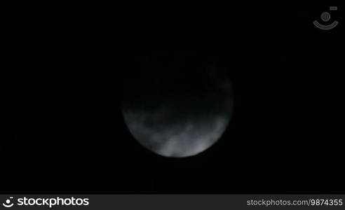 Scary Full Moon in a Cloudy Night. Very detailed lunar surface with its valleys and craters. Suitable for fear, scary and terror scenes. Awesome full moon. Night of wolf, Halloween night, nightmare.