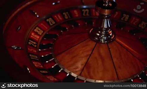 Scene shows a turning roulette wheel during a game