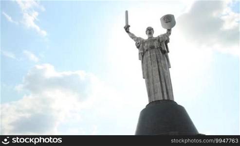 Sculpture as a woman with a sword and shield - a monument "Motherland" in Kyiv, Ukraine