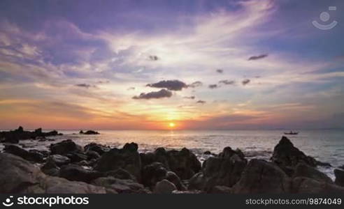 Sea sunset on rock shore slide panorama time lapse