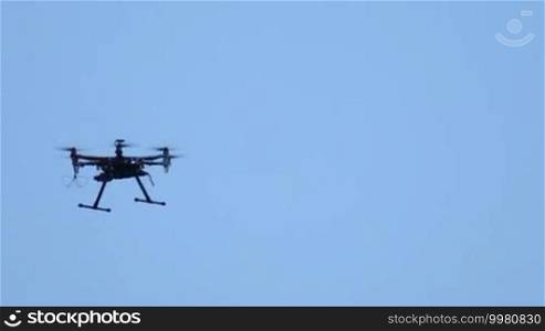 Six engine drone flies and shoots video