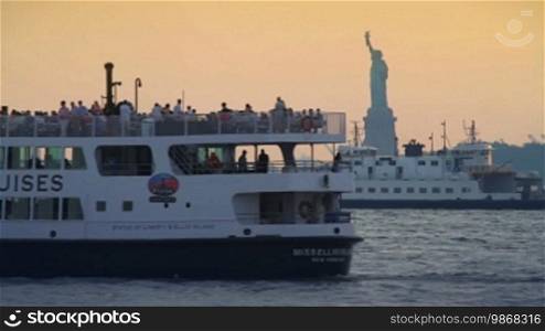 Skyline sunset, Statue of Liberty, Statue Cruises boat passing, New York City