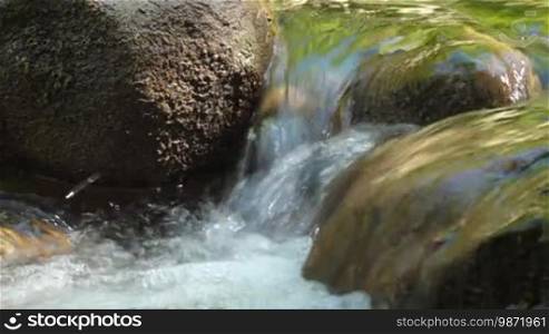 Small mountain stream with rocks in Crimea.