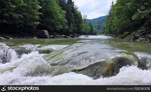 Small waterfall and river in the Carpathian Mountains