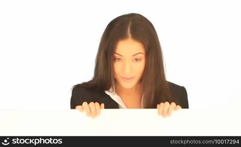 Smiling friendly attractive businesswoman holding a blank white board in her hands for your text or advertisement