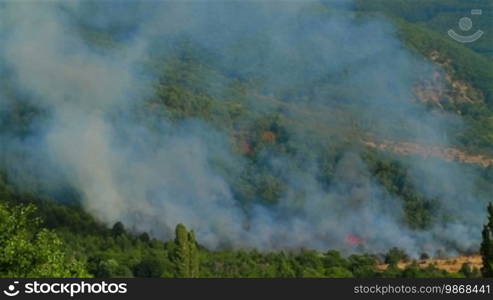 Smoke from a mountain forest fire