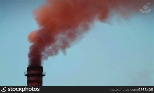 Smoke from the chimney of a ferronickel factory polluting the environment