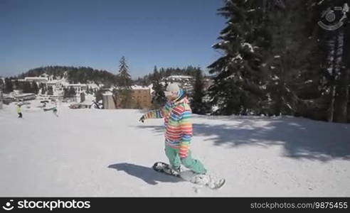 Snowboarder perform tricks